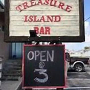A sign for the treasure island bar