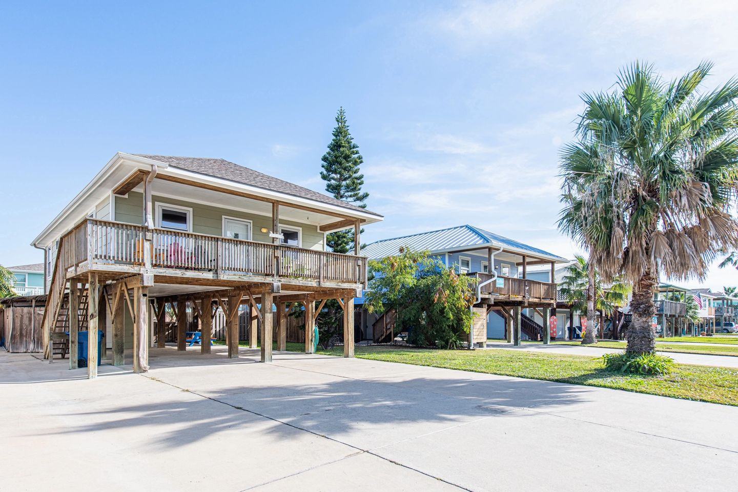 A house with two levels and a deck in the middle.