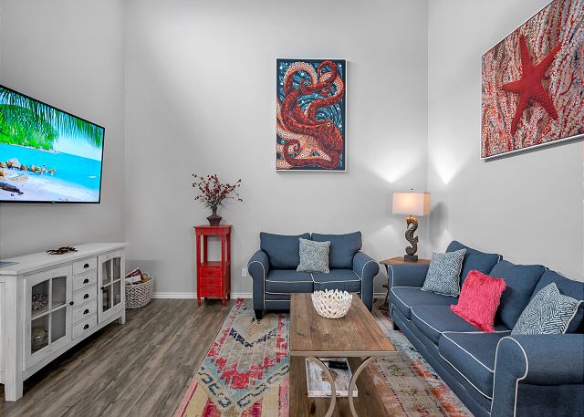 A living room with couches and a television.