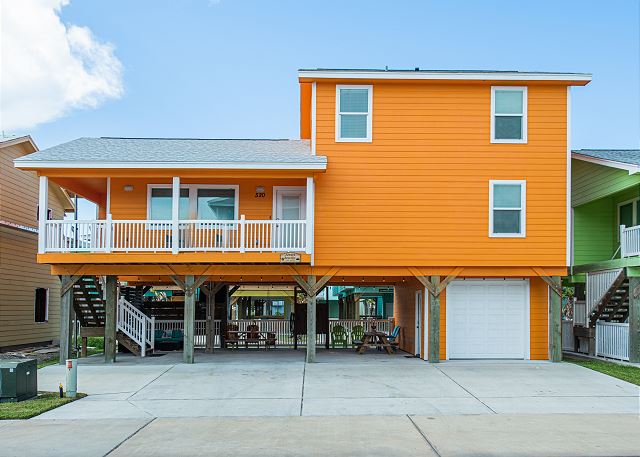 A house with orange walls and white trim.