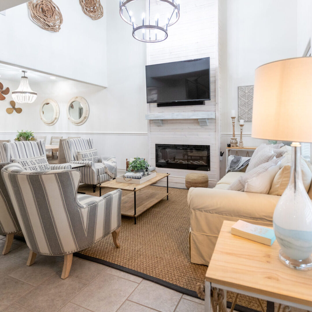 A living room with two chairs and a fireplace.